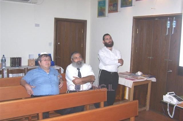 מ