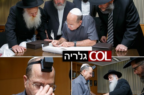 בעיצומה של המלחמה: שר הביטחון מניח תפילין, כותב אות 